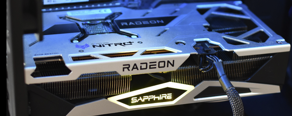 A sapphire Radeon Nitro GPU. With the Sapphire writing glowing in yellow.